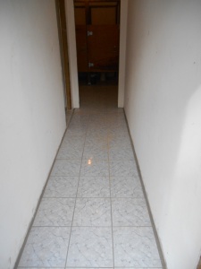 Hallway leading to the school bathroom that the team tiled.