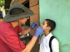Rick providing a fluoride treatment  